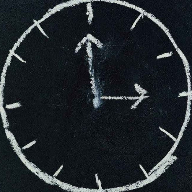 analog clock sketch in black surface